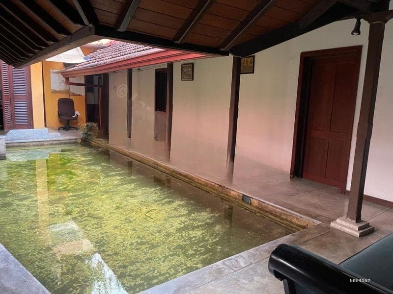 Land with house and building; offered at land value